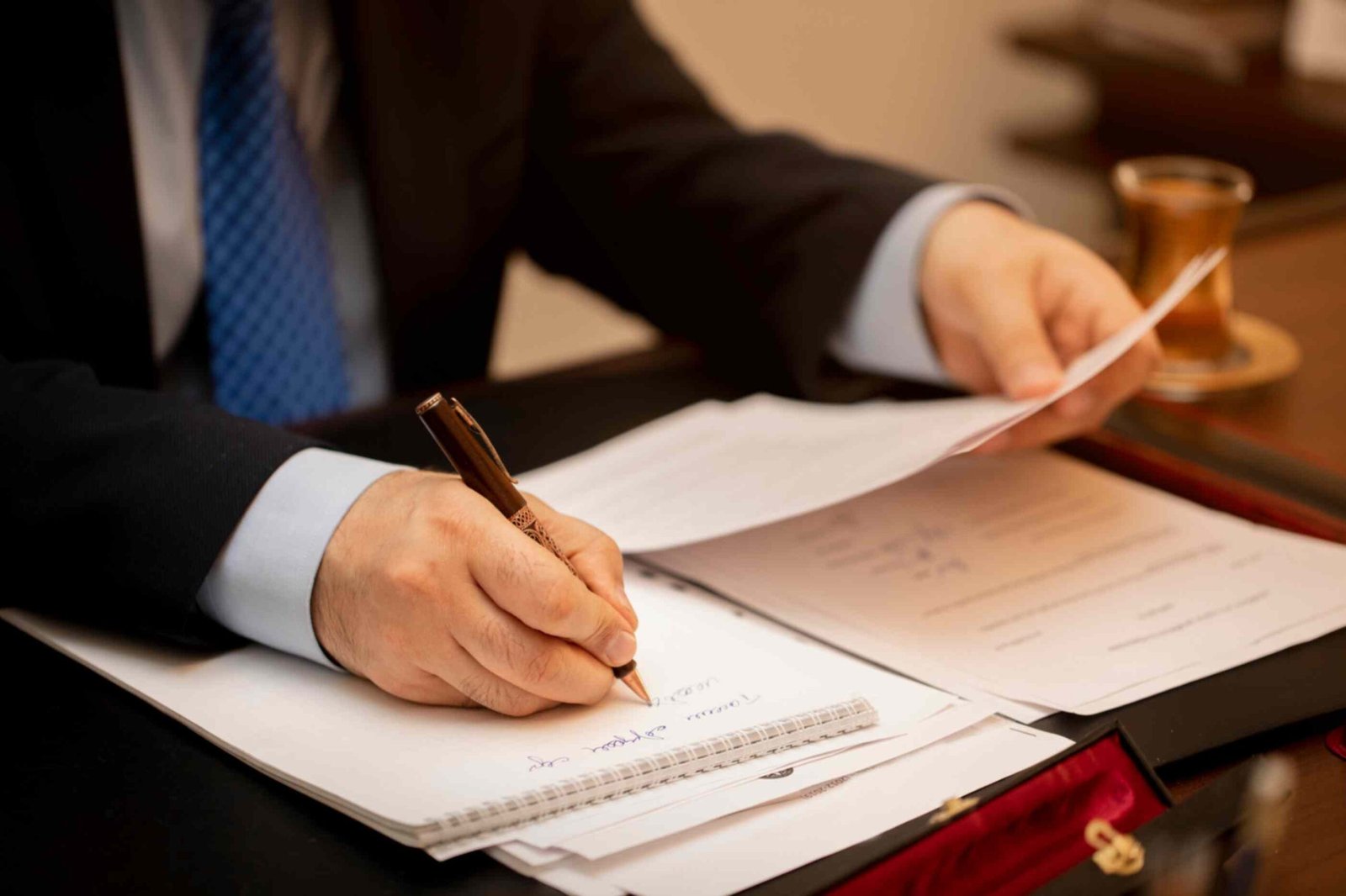Businessman signing important contract papers